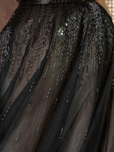 Richly embellished tulle volume gown